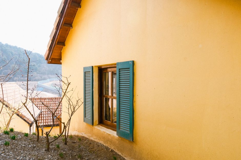 Close view of a painted wall surface and window frame