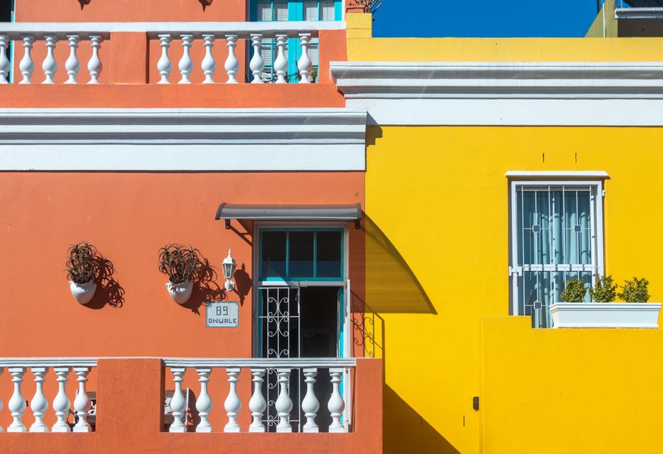 Painted house wall with a window and trim