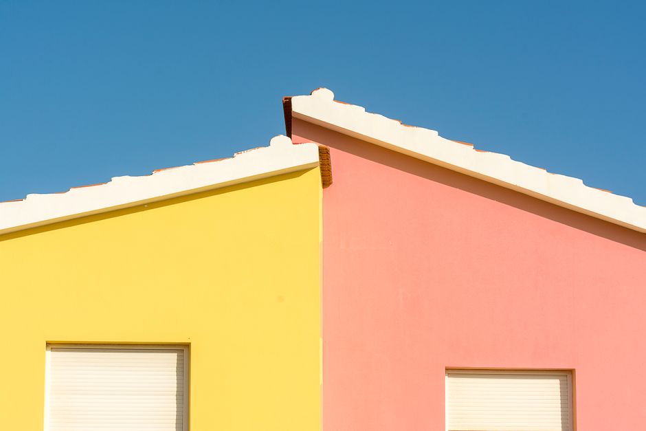 Freshly painted house front with white trim