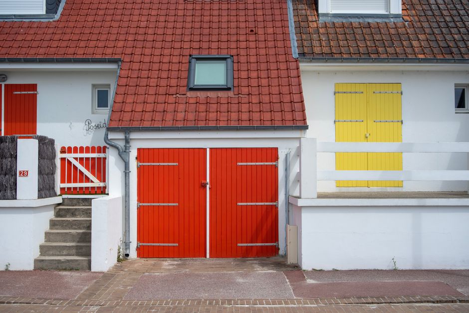 Painted house wall with a window and trim