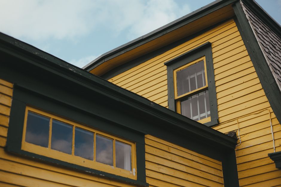 Close view of a painted wall surface and window frame